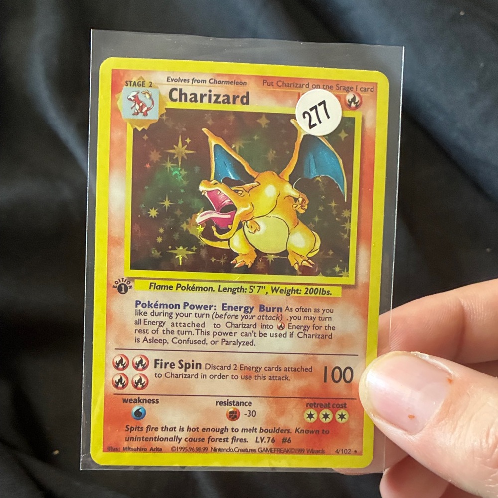 Pokemon Charizard Card with Red and Yellow Accents